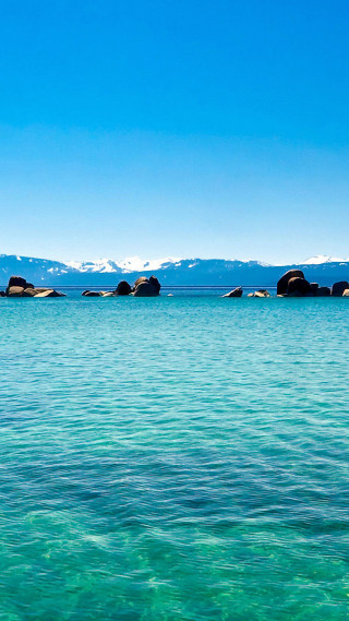 Water rocks mountains distance scenery - rock free wallpaper