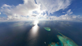 Water sky clouds view nature - a small island in the middle of the water free wallpaper