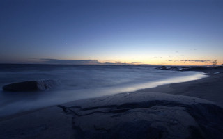 Beach rock sunset clouds scenery - a rock in the middle of it free wallpaper