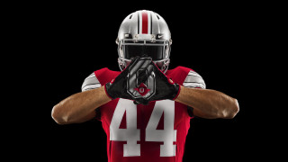 Football player uniform holding ball 4 - cleve gray free wallpaper