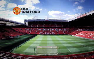 Stadium green field red wall - a stadium free wallpaper