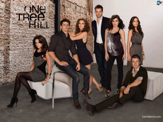 Group people posing brick wall - a brick wall free wallpaper