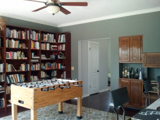 Foosball table bookcase books ceiling - dull free wallpaper