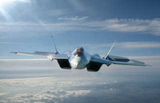 Jet flying sky clouds sun - a jet free wallpaper