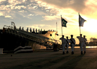 Men walking large ship sunset - a large ship free wallpaper