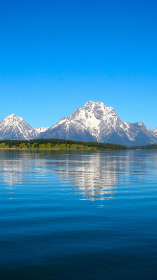 Boat water mountains blue sky - a boat free wallpaper
