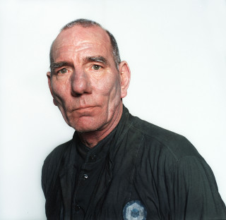Bald man black shirt serious 3 - serious free wallpaper
