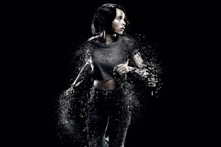 Woman black top splashing water - promotional image free wallpaper