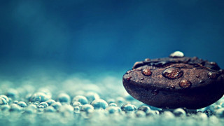 Rock water droplets blue background 2 - a close up of a rock free wallpaper