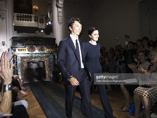 Man woman walking runway crowd - their hands in free wallpaper