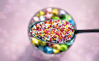 Spoon filled colorful candy sprinkles - pointillism free wallpaper