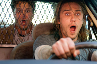 Surprised man driving woman behind - movie scene free wallpaper