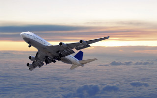 Jetliner cloudy sky above clouds - liminal free wallpaper