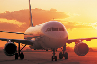 Jetliner airport tarmac sunset sun 3 - the sun setting behind free wallpaper