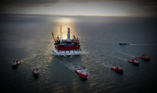 Large boat ocean surrounded smaller - a large boat in the middle of the ocean free wallpaper
