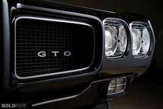 Black car grille close up - a black car free wallpaper