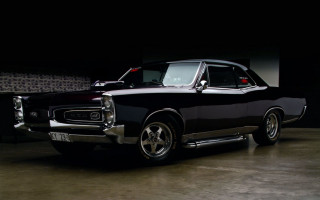 Black car garage wall clock - a black car free wallpaper