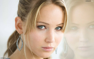 Woman ponytail earrings serious look 2 - eye free wallpaper