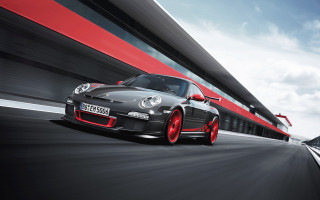 Black car red white wall - a black car free wallpaper