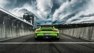 Green sports car cloudy sky - a green sports car free wallpaper