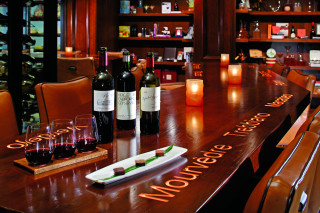 Wine glasses bottles candles restaurant - promotional image free wallpaper