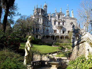 Large building statue garden flowers - a statue in front free wallpaper