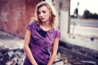 Woman standing junk brick wall - a brick wall behind her free wallpaper