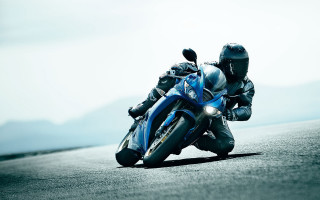 Motorcycle ride mountains water distance - a person riding free wallpaper