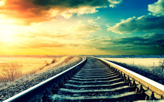 Train track sunset clouds sky 9 - grass and bushes free wallpaper
