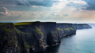 Cliff water cloudy sky landscape 2 - a large cliff free wallpaper