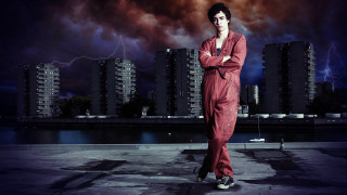 Man red jumpsuit city skyline - lightning free wallpaper