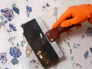 Person orange gloves removing wallpaper 3 - paper texture free wallpaper
