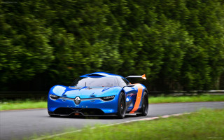 Blue orange sports car driving - a forest of trees and bushes free wallpaper