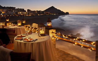 Romantic pastel beach city sunset - a white table cloth free wallpaper