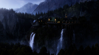 Castle cliff waterfall night lights 3 - a waterfall in the background free wallpaper