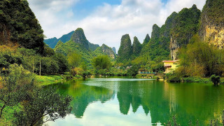 Lake mountains trees house foreground - the other side of it free wallpaper