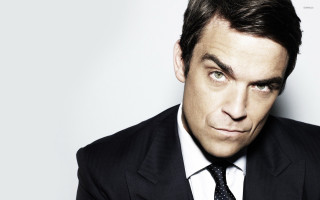 Man suit tie smirk portrait - his eye wide open free wallpaper
