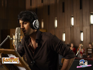 Man headphones microphone stand background - movie still frame free wallpaper