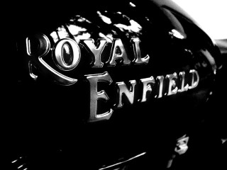 Royal enfield motorcycle emblem parking 2 - a parking lot free wallpaper