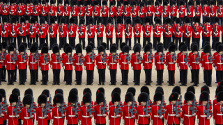 Red uniforms black hats tails - a large group of people free wallpaper
