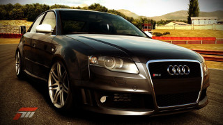 Black car parked road fence - a black car free wallpaper