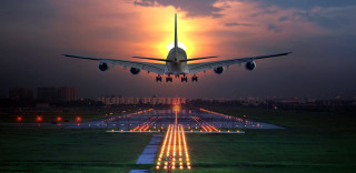 Jetliner night runway sunset airplane - the sun setting behind free wallpaper