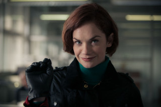 Woman black jacket green sweater - a black glove free wallpaper