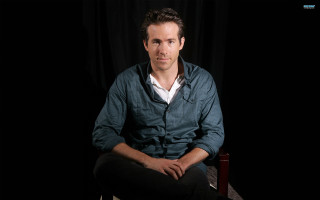 Man sitting chair dark room - brad holland free wallpaper