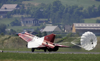 Red white plane parachute landing - a parachute free wallpaper