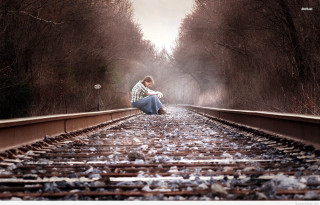Woman sitting train track woods - her mouth free wallpaper