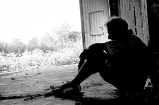 Man sitting ground building door - brassaï free wallpaper