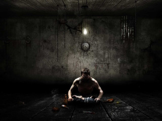 Man sitting dark room clock 4 - the wall behind free wallpaper