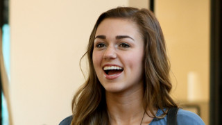 Smiling woman blue shirt looking - emily shanks free wallpaper
