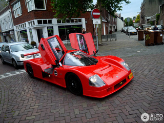 Red sports car brick road - matte finish free wallpaper